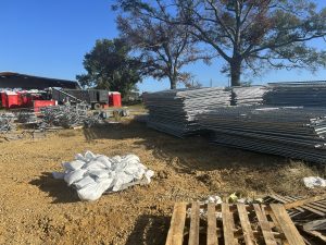 unassembled temporary fencing in yard